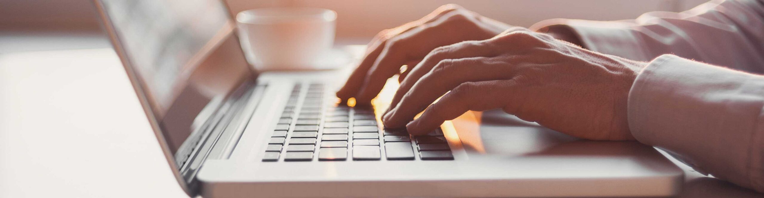 Man typing at a computer - Resource center