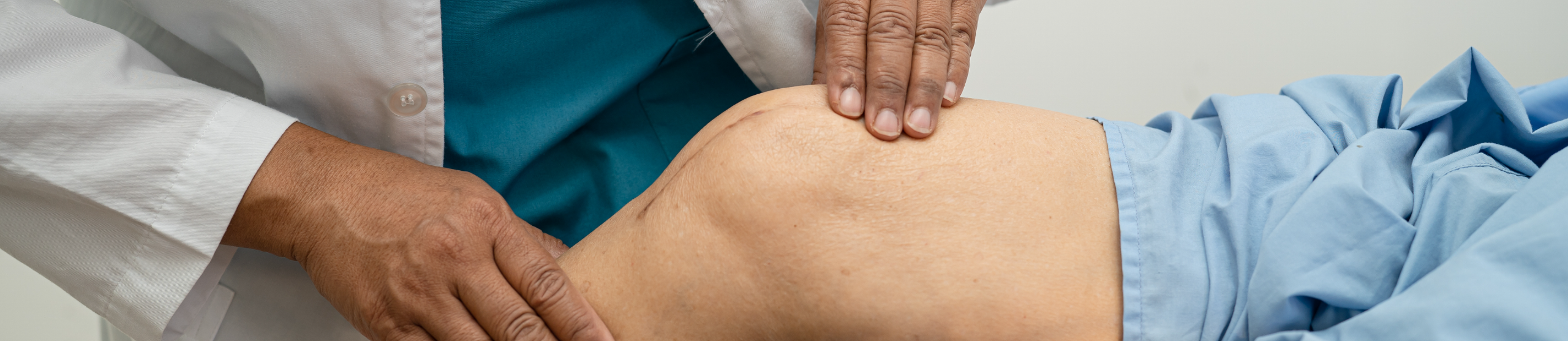 Dr putting on face mask in blue scrubs - Work for us